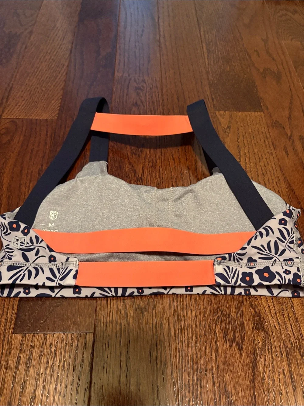 Born Primitive Floral Navy and White Women's sports bra with Orange Accent